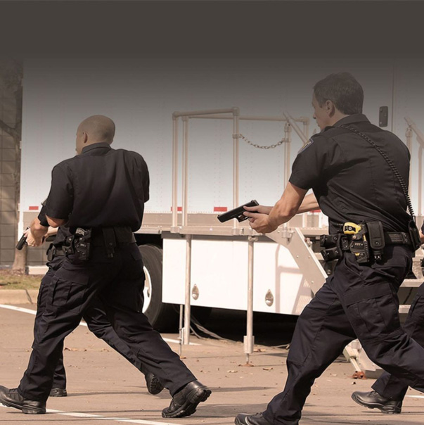 Two NASTEC security perrsons with guns in their hands